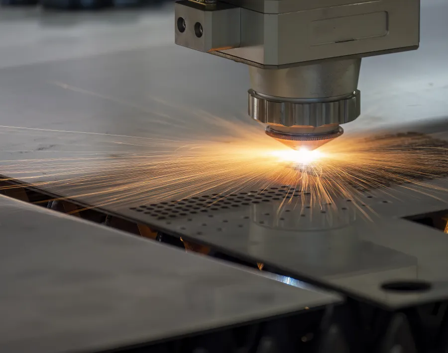 A fiber laser cutting machine cutting a metal plate.
